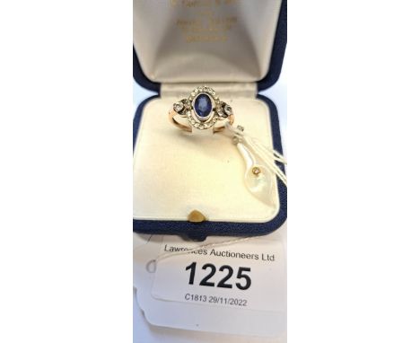 9ct Yellow gold blue stone set ring, and a mother of pearl and white gold pendant set with diamonds 