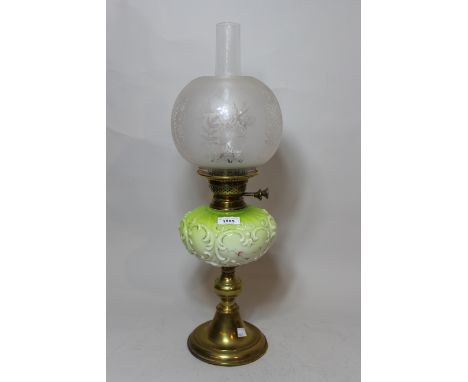 Late Victorian brass and green opaque glass oil lamp with an etched glass shade 