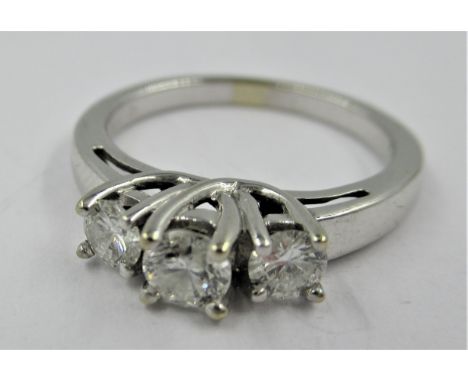 14ct White gold ring set three brilliant cut diamonds, size 'K' 