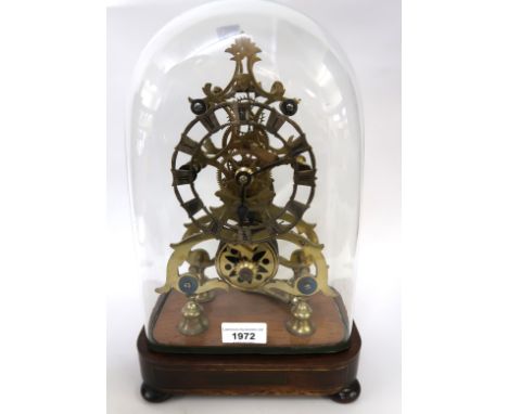 19th Century brass skeleton clock, the silvered dial with Roman numerals, with a single train fusee movement housed under a g