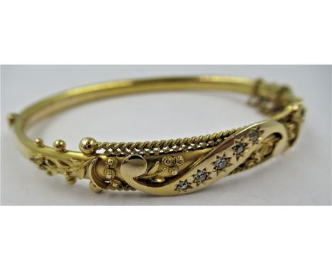 Edwardian 15ct gold and diamond set bangle, interior dimensions 60 x 50mm, 9.2gmsIn good overall condition. Tiny indentation 