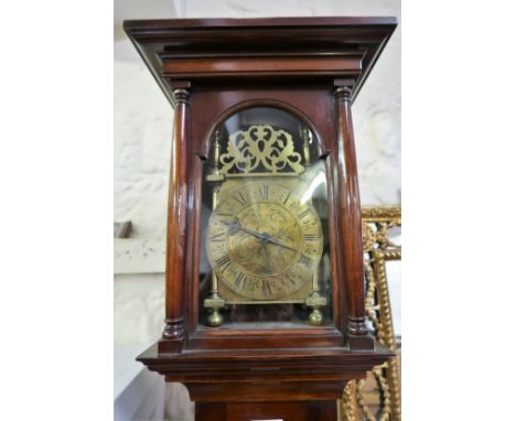 Unusual mahogany longcase clock, incorporating an antique lantern clock movement, the rectangular hood with flanking pilaster