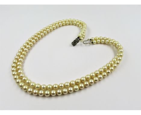 Double row uniform cultured pearl necklace with 9ct gold clasp, 44cms 