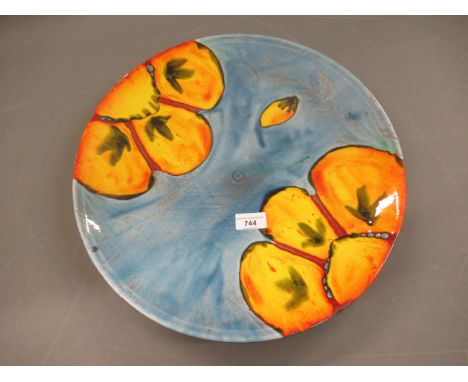 Poole pottery, large circular wall charger of floral design, 15.75ins diameter 
