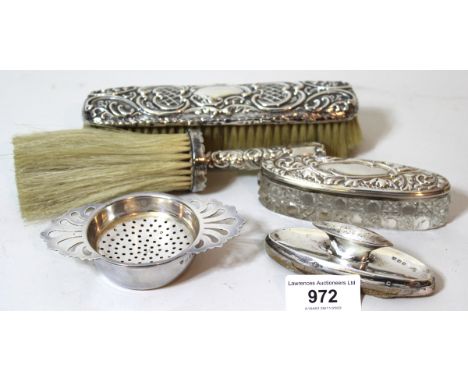 Two silver mounted brushes, dressing table box, nail buffer and a silver tea strainer on standStrainer is hallmarked ' London