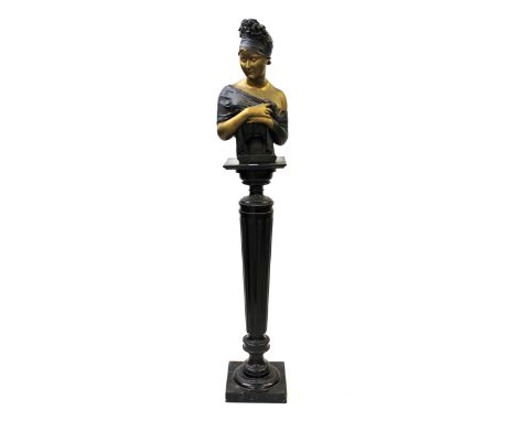 Painted plaster bust of a semi nude classical female mounted on an ebonised column support, 67ins high overall 