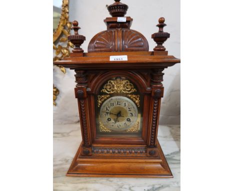 19th Century walnut manel clock, the gilded and silvered dial with Arabic numerals with a two train movement striking on a go