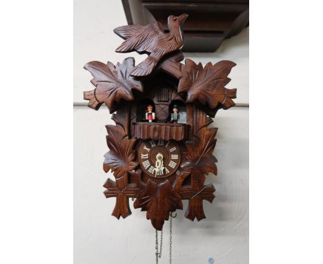 Late 20th Century cuckoo close, the case in thr form of a chalet, Continetal ebonised and brass mounted cased mantle cock wit