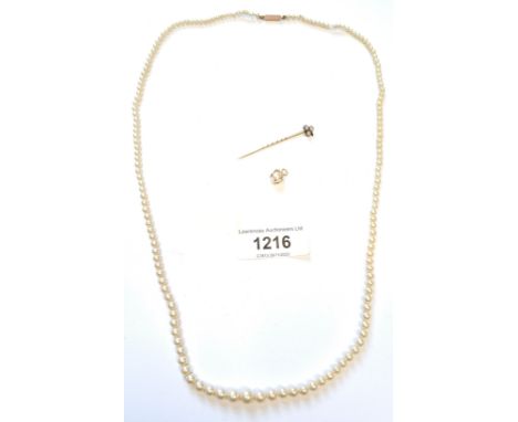 Yellow metal split seed pearl set stick pin, cultured pearl necklace with 9ct gold clasp, and a pearl pendant 