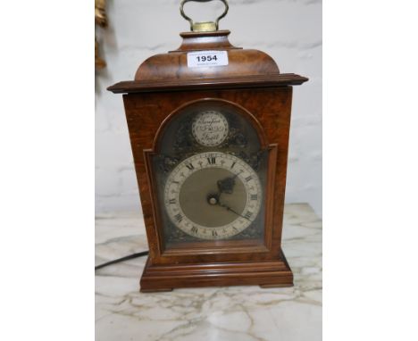 Reproduction burr walnut cased mantel clock, with electric movement, together with a small 19th Century spelter cased mantel 