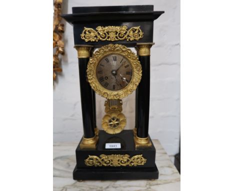 19th Century French ebonised and gilt metal mounted portico clock, having circular engine turned dial with two train movement