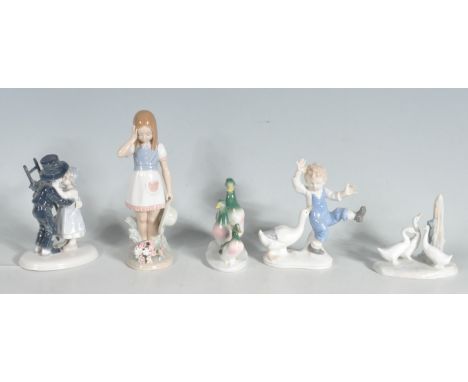 A collection of Valencian style figurines to include a Lladro figurine of a girl with a basket of flowers (one flower broken)