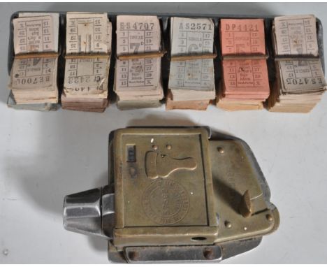 A large collection of vintage retro 20th century buss tickets with original metal holder and a vintage ticket puncher - The B