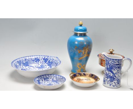 A collection of mid 20th century Japanese Noritake ceramic porcelain ware to include a large blue and gilt lidded baluster va