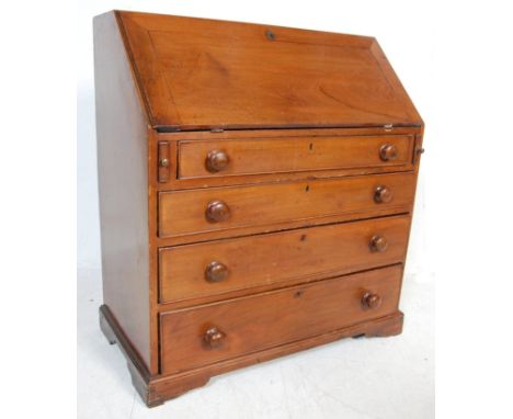 A 19th Century Victorian mahogany bureau chest of drawers having a fall front desk to the top with section interior within, m