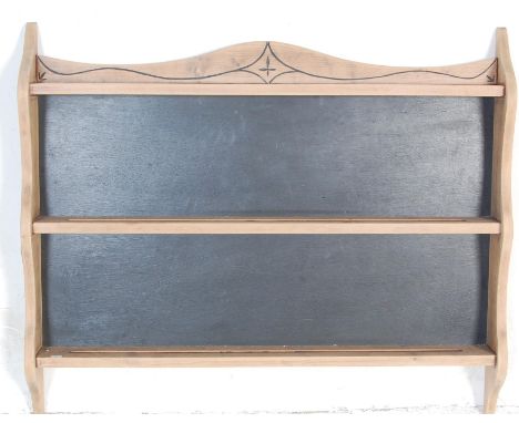 A retro vintage late 20th century Elm Ercol plate / spice rack having a shaped gallery back with three tiered shelves. Item h