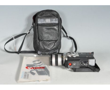 A retro vintage 1960s mid 20th century portable Canon Autozoom 8mm 814 video camera. Comes with instruction manual and should