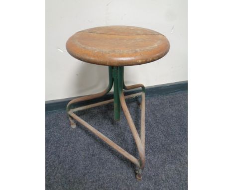 A circular adjustable industrial machinist stool 