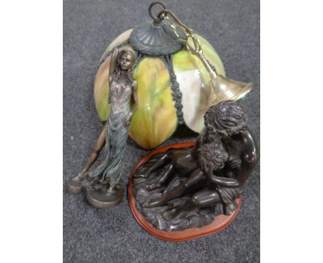 A leaded glass light shade in the style of Christopher Wray together with two contemporary figures 