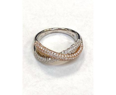An 18ct rose, yellow and white gold pave set diamond cross over style ring, approximately 0.91ct.