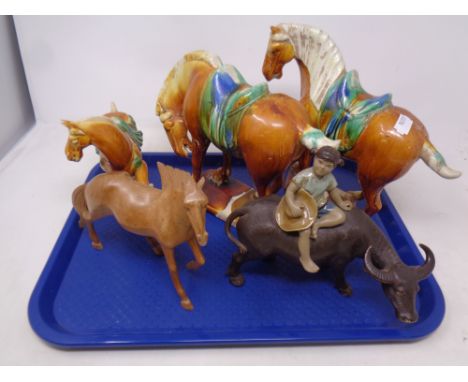 A tray containing Chinese ceramic Tang style horses, figure of a girl, carved wooden horse 