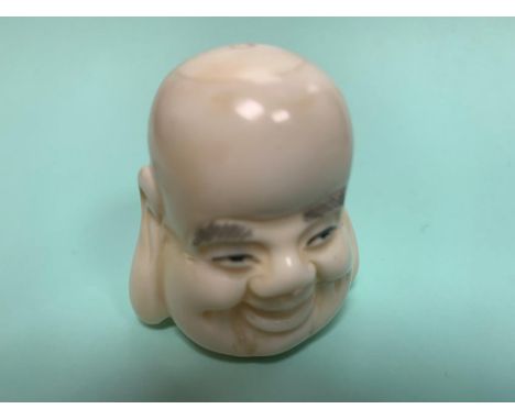 A Japanese carved bone netsuke - Head of Buddha.  