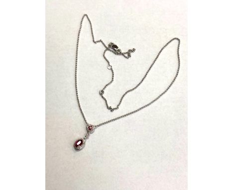 A 9ct white gold ruby and diamond pendant, the ruby approximately 0.45ct.