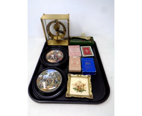 A tray of brass cased Kundo mantel clock, assorted playing cards, two 19th century pot lids in frames, Singer sewing machine 