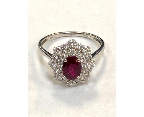 A ruby and diamond fancy cluster ring, approximately 0.81ct, ruby 1.03ct, size  N/O.