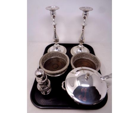 A tray of good quality silver plated wares, Viners plated candlesticks, pair of oak and silver wine coasters, Viners sugar si