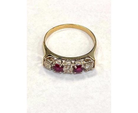 A yellow gold diamond and ruby half eternity ring, approximately 0.45ct.