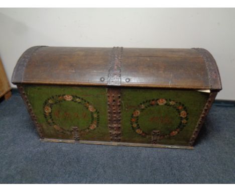 A 19th century metal bound oak domed shipping trunk 