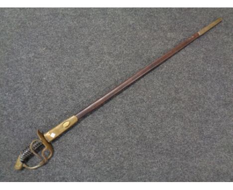 A 19th century brass hilted court sword in leather and brass mounted scabbard 