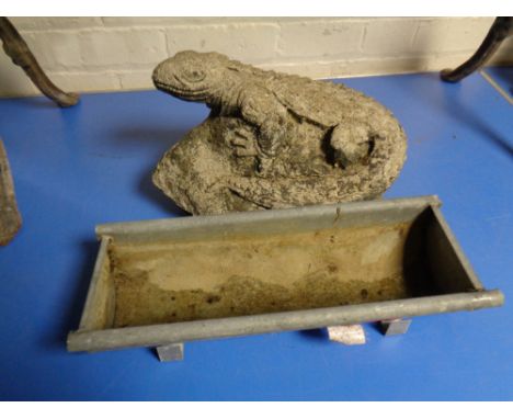A concrete ornament - lizard on rock together with a small galvanized trough 