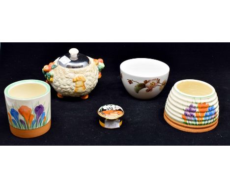 A collection of Clarice Cliff items to include Crocus pattern and Celtic harvest jam pot, along with two reproduction items o