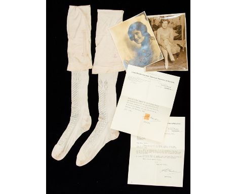 Queen Victoria (1819-1901). A pair of Queen Victoria's stockings in cream silk, made in 1850. The stockings are embroidered '
