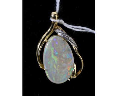 A single stone opal and diamond pendant, the ovoid opal in diamond set scrolling mount, marked '750', overall length 3cm, opa