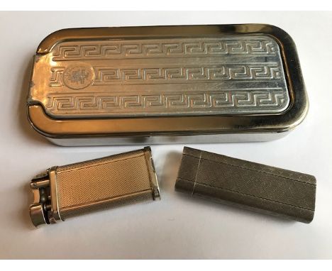 A vintage Cartier white metal pocket lighter, machine engraved, a Dunhill white metal pocket lighter and a Rolls Razor (3)