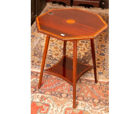 An Edwardian inlaid mahogany octagonal occasional table, raised on spread tapered legs united with a shelf. 70cm H x 59cm W