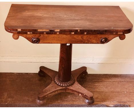 A 19th Century mahogany folding card table, demi-lune shape top with ebonised inlay, comprising an inlaid card playing surfac