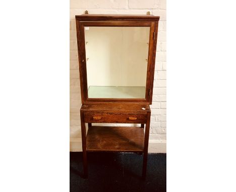 A 20th Century mahogany glazed display cabinet with two glass shelves together with a similar oak hall table with single draw