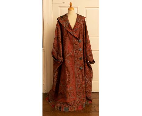 A iconic 1920s wool tapestry coat in autumnal shade with large cowl collar, looped button fastings and Roglan sleeves with co