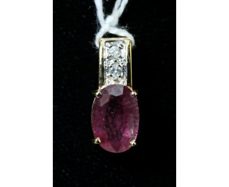 A ruby and diamond pendant, the oval cut ruby in four claw mount, on two stone diamond set, 18ct gold bale,  gross weight 3.5