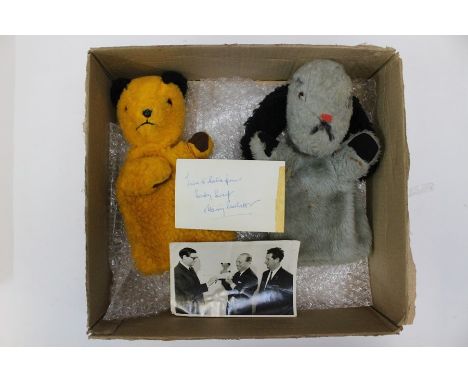 A Chad Valley Sooty and Sweep puppet pair, together with a signed Harry Corbett postcard and another photo.