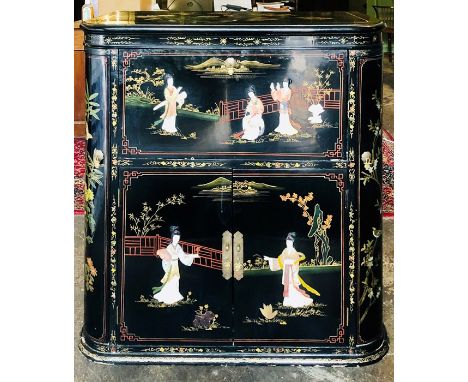 A Chinoiserie lacquered drinks cabinet, demi-lune shape with a lid reveals more two panel lids on a fall front, above a two p