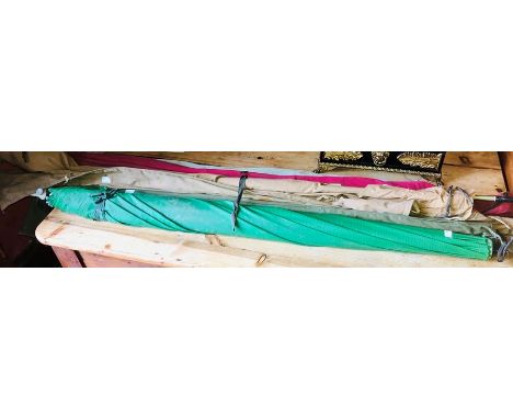 Fishing and hunting interest, six fishing rods with a fishing umbrella.&nbsp;