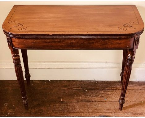 A George IV rosewood card table, circa 1820, rounded rectangular hinge fold over twist top enclosing inlaid card playing surf