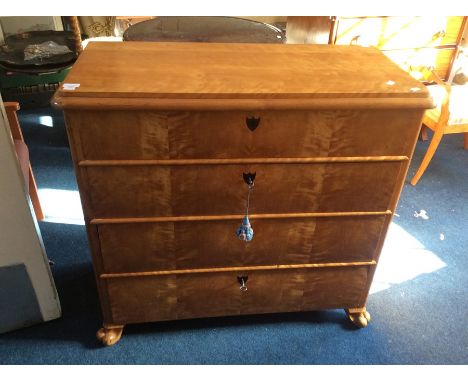 A 19th Century sycamore commode of Biedermeier design, the figured top with ovolo lip above four figured drawers each centred