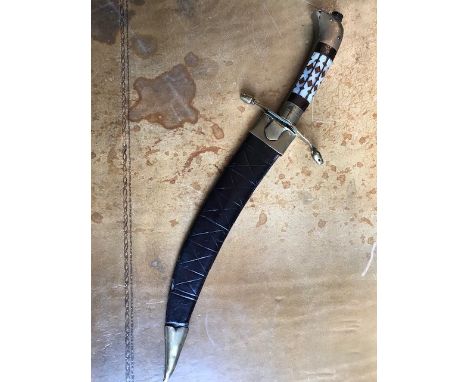 A Middle Eastern dagger, the hilt inset with mother of pearl, leather scabbard, length 33cm