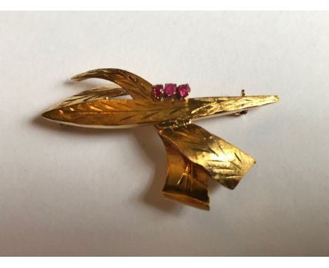 An 18ct gold ruby set spray brooch